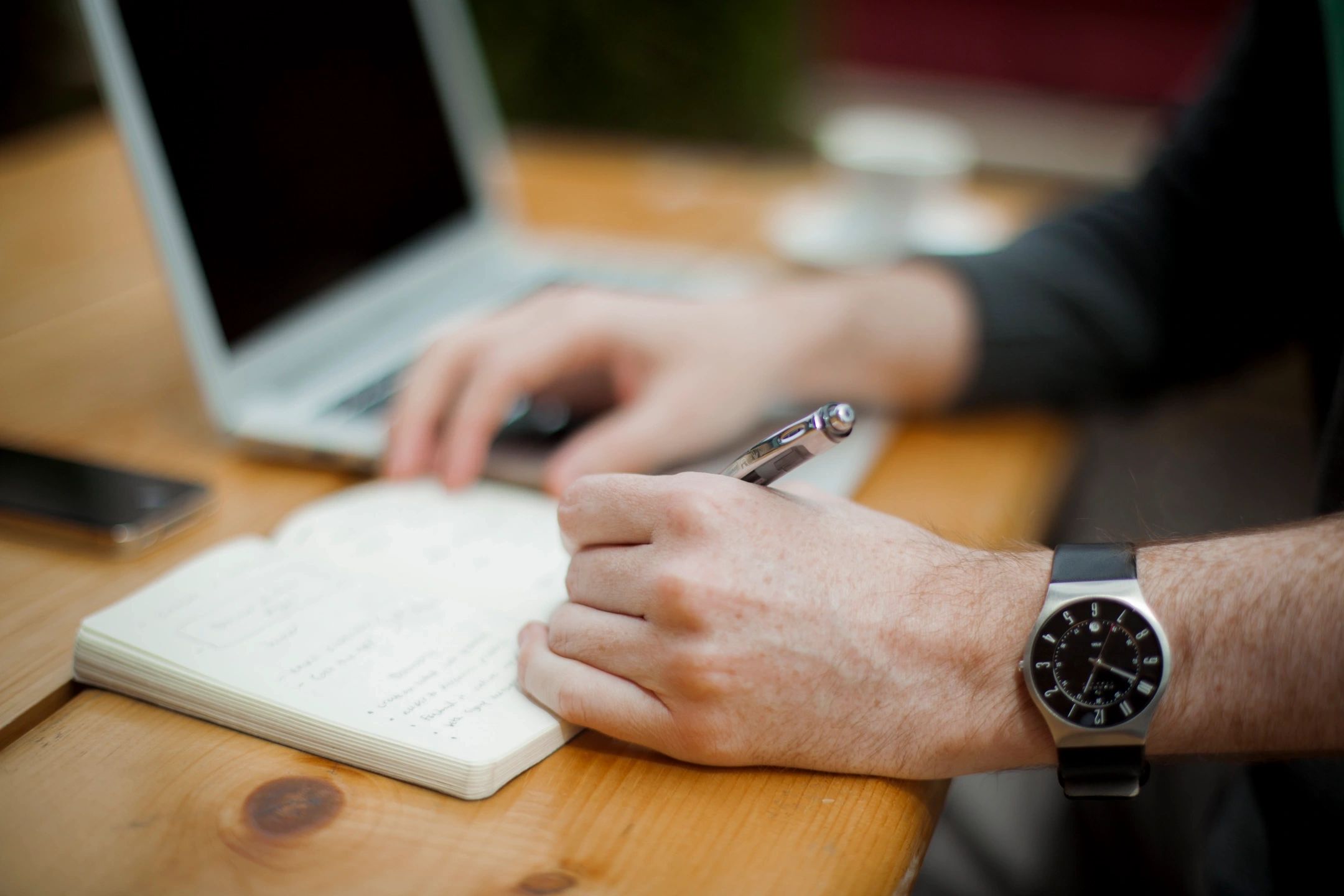 background image of hand writing on notebook